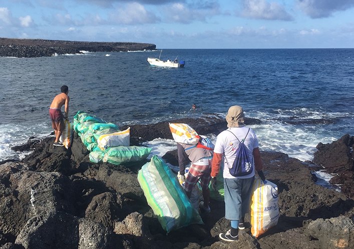 Sacks filled with plastic being removed from Genovesa Island.